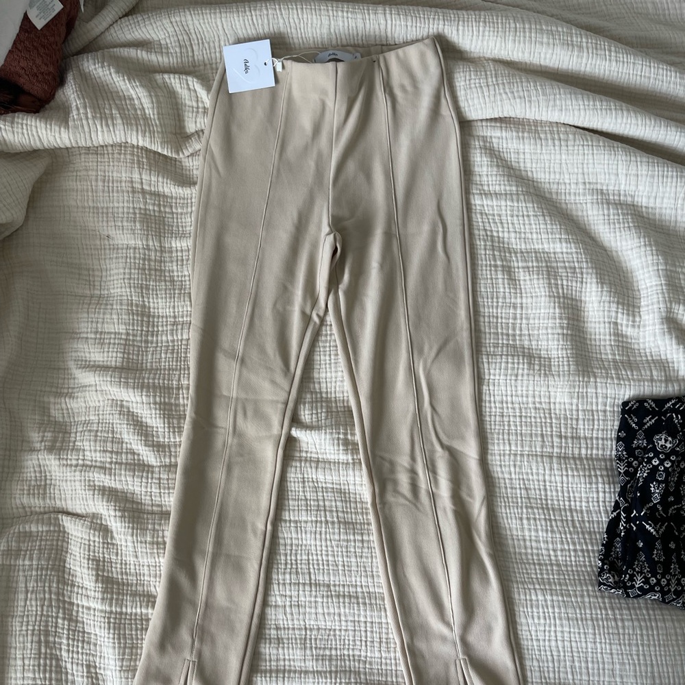 Tan pants from adika. Size S, high waisted with slit at bottom
